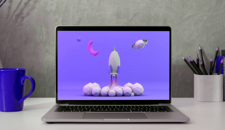 Laptop showing a cartoon rocket ship on the screen, growth hacker